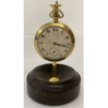 A vintage gold filled pocket watch with engine turned detail to face and back of case.