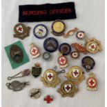 A collection of assorted vintage badges relating to nursing and medical treatment.