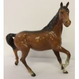 Beswick "Spirit of the Wind" ceramic horse figurine in chestnut brown gloss finish.