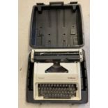 A vintage "Carina 2" typewriter by Olympia. Complete with carry case.