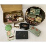 A collection of vintage hairpin boxes, hairpins, hair clippers and small vanity mirrors.