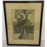 A framed and glazed 19th century Japanese signed wood block print depicting an oriental lady.