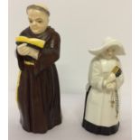 2 Royal Worcester ceramic candle snuffers in the form of a monk and a Nun.