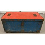 A vintage wooden painted tool chest with metal banding and hinged split lid.