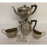 A vintage silver plated 4 piece tea set together with a heavy Sheffield plate cruet.