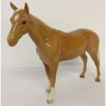 A Beswick ceramic Bois Roussel Racehorse in Palomino colourway.