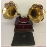 A reproduction wooden cased twin horn gramophone marked "Victrola".