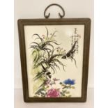 A signed porcelain Chinese ceramic plaque depicting birds and flowers.