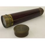 A vintage brass 3 draw telescope with wooden casing, complete with lens cap.