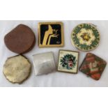 7 vintage compacts of varying sizes and designs.