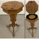 A vintage pine sewing box, trumpet table, raised on tripod feet with turned pedestal.