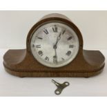 An Art Deco dark oak cased H.A.C make, German, Westminster chime mantle clock.