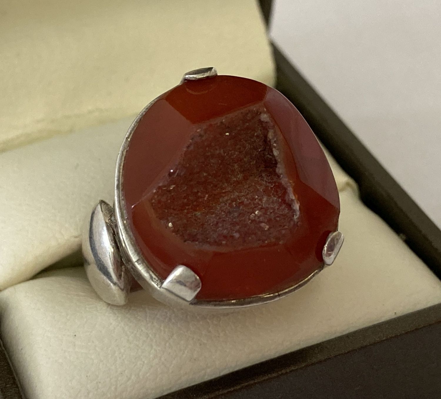 A contemporary design silver dress ring set with carnelian druzy.