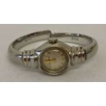 A ladies vintage 10K white gold filled bangle watch by Bulova.