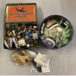 2 tins of haberdashery items, to include buttons, hooks and eyes, press fasteners and cottons.