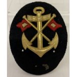 A WWII style Kriegsmarine Signals NCO's career sleeve insignia.