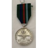 A silver Voluntary Service Medal on ribbon. Hallmarked London 1994.