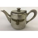 A German WWII style Kriegsmarine silver plated tea pot with eagle and swastika emblem.