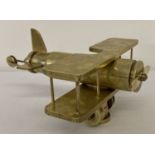 A trench art Bi Plane made from shell casings.