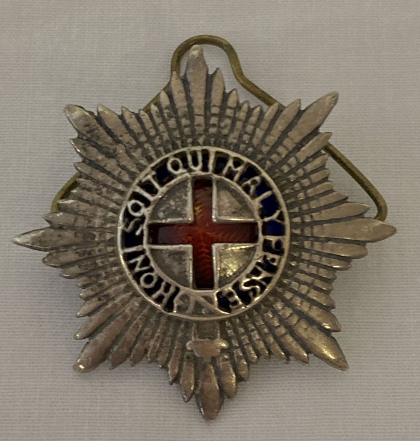 A vintage Coldstream Guards Warrant Officers cap badge.