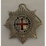 A vintage Coldstream Guards Warrant Officers cap badge.