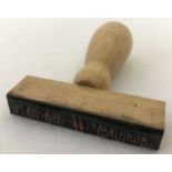 A German WWII style Waffen SS wooden handled rubber ink stamp to the Dutch "Westland".