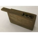 A WWII style German stick grenade wooden fuse box with sliding lid.