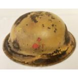 A WWII style experimental coloured British brodie helmet.
