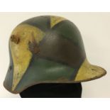 A WWI style Imperial German M-16 Stahlhelm helmet with hand painted Jigsaw pattern camo design.