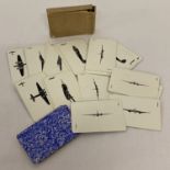 A deck of WWII aircraft identification cards with blue backs in original box.