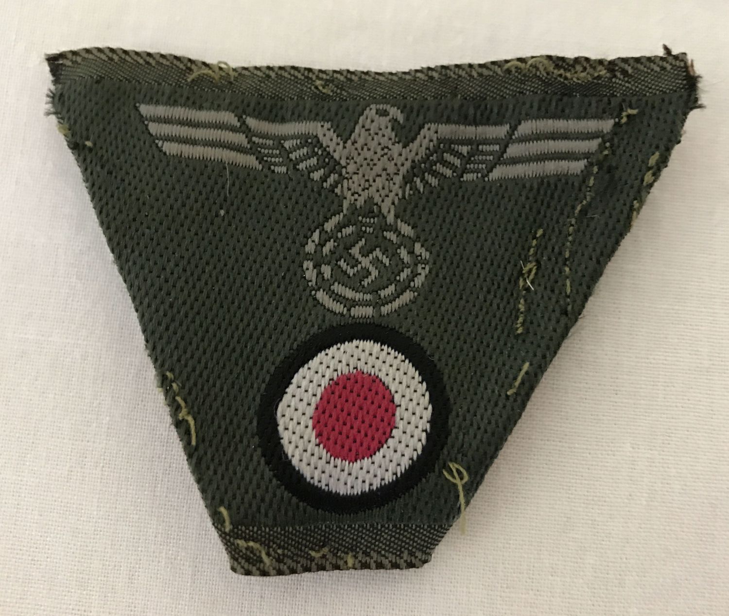 A German WWII style overseas cap cloth embroidered badge.