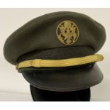 A Vietnam war era American army peaked cap with cap badge.