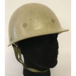 A Gulf War veteran bring back Iraqi helmet with canvas straps.