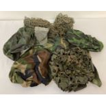 A quantity of assorted helmet nets, covers and scrim.