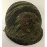 A Vietnam War style A.R.V.N Special Forces helmet with hand painted detail.