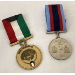 A 1991 Kuwait liberation medal together with a Pakistan Air Force medal. Both with ribbons.