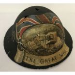 A WWI style British Brodie helmet with hand painted post war memorial.