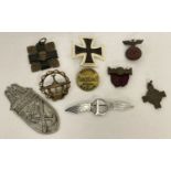 A small collection of military related badges to include German and a handmade sweetheart brooch.