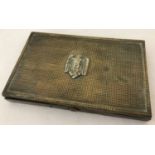 A WWII style German brass cigarette tin/face powder compact with Nazi eagle emblem.