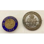 2 WWI service badges, one with blue enamel detail.