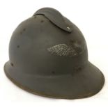 A WWII style captured French M23 Casque helmet used by the German Luftshutz (Air Raid Police).