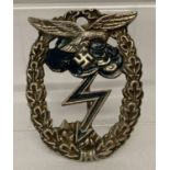 A WWII style German Luftwaffe ground assault badge with cloud and lightening detail.