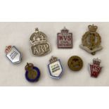 A small collection of assorted military related badges.