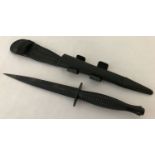 A current issue British Commando dagger with leather scabbard.