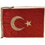 A WWI style Ottoman Empire Turkish flag with rope and wooden tog detail.