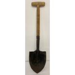 A military style trench spade with wooden handle.