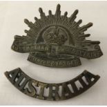 A WWI style Australian Rising Sun cap badge and shoulder title.