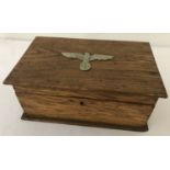 A WWII style German wooden documents box with white metal Nazi eagle insignia mounted to lid.