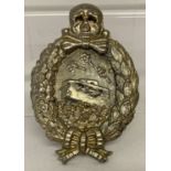 A WWI style tank crew (Weimar Republic) silver tone badge.