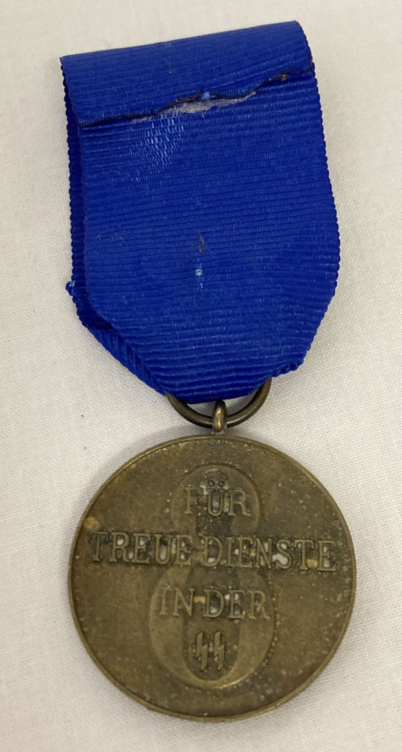 A WWII style SS 8 year service medal on a blue ribbon.